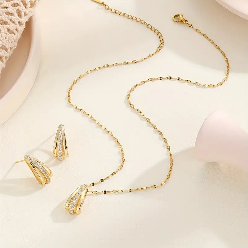 Radiate Timeless Elegance with Our 18KGold CZ Teardrop Earring and Necklace Set